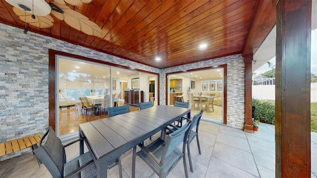 14424 Neptune Rd, Seminole, FL 33776 - dining area with wooden ceiling, light tile patterned flooring, and recessed lighting