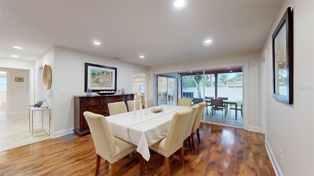 14424 Neptune Rd, Seminole, FL 33776 - dining room with recessed lighting and wood finished floors