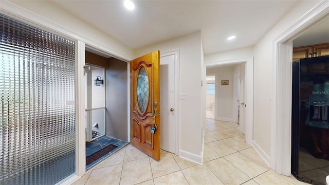 14424 Neptune Rd, Seminole, FL 33776 - entrance foyer featuring light tile patterned flooring and recessed lighting