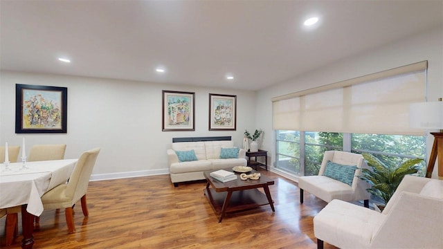 14424 Neptune Rd, Seminole, FL 33776 - living room featuring wood finished floors and recessed lighting