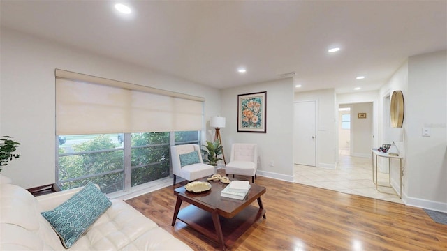 14424 Neptune Rd, Seminole, FL 33776 - living room featuring light wood-style floors and recessed lighting