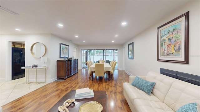 14424 Neptune Rd, Seminole, FL 33776 - living room with recessed lighting and light wood finished floors