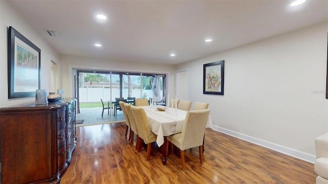 14424 Neptune Rd, Seminole, FL 33776 - dining space with wood finished floors and recessed lighting