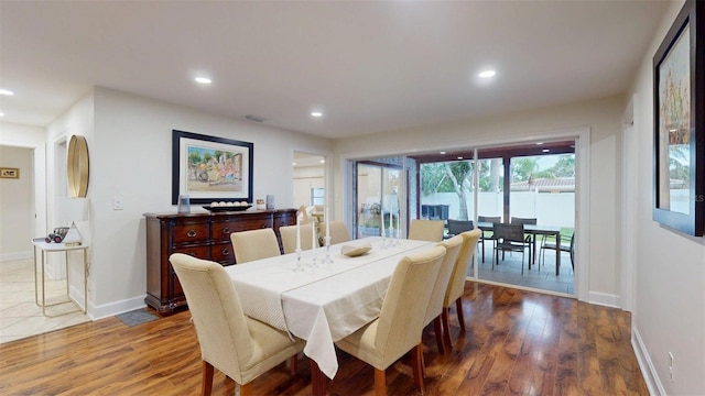 14424 Neptune Rd, Seminole, FL 33776 - dining area featuring wood finished floors and recessed lighting