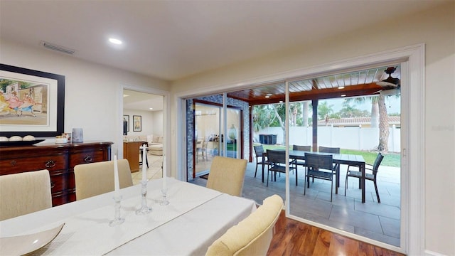 14424 Neptune Rd, Seminole, FL 33776 - dining room with wood finished floors and recessed lighting