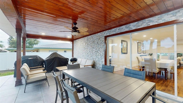 14424 Neptune Rd, Seminole, FL 33776 - view of patio with outdoor dining area, a ceiling fan, and a grill
