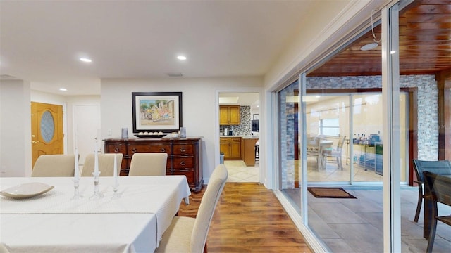 14424 Neptune Rd, Seminole, FL 33776 - dining area featuring recessed lighting and light wood finished floors