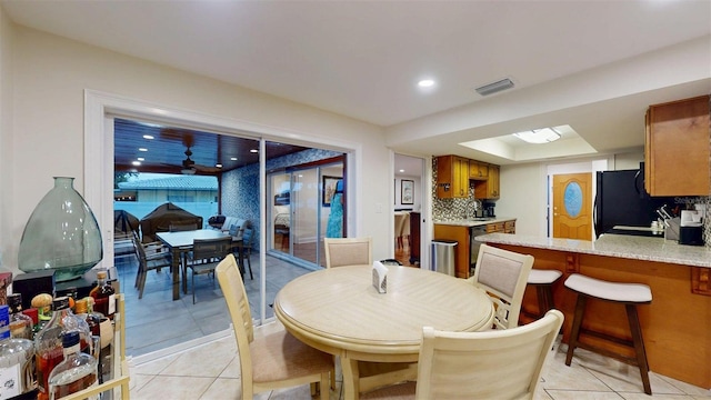 14424 Neptune Rd, Seminole, FL 33776 - dining room featuring light tile patterned floors and recessed lighting