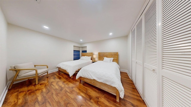 14424 Neptune Rd, Seminole, FL 33776 - bedroom featuring wood finished floors, recessed lighting, and a closet