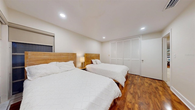 14424 Neptune Rd, Seminole, FL 33776 - bedroom with wood finished floors, recessed lighting, and a closet