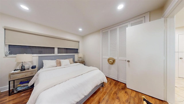 14424 Neptune Rd, Seminole, FL 33776 - bedroom with wood finished floors, a closet, and recessed lighting