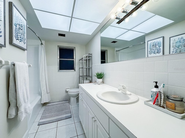 14424 Neptune Rd, Seminole, FL 33776 - bathroom featuring tile walls, vanity, tile patterned flooring, and shower / bath combo with shower curtain
