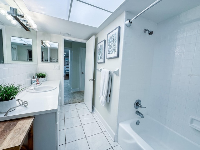 14424 Neptune Rd, Seminole, FL 33776 - full bath featuring tile patterned floors, vanity, and shower / bathtub combination