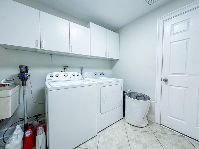 14424 Neptune Rd, Seminole, FL 33776 - laundry area featuring cabinet space and washing machine and clothes dryer