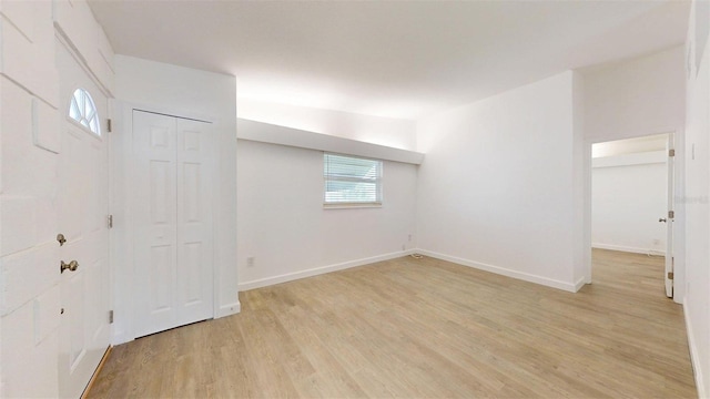 1431 Island Dr S, South Pasadena, FL 33707 - foyer entrance featuring light wood-type flooring and baseboards