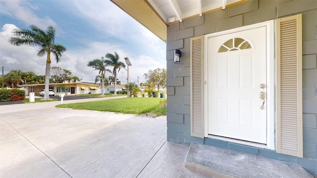 1431 Island Dr S, South Pasadena, FL 33707 - doorway to property featuring a yard