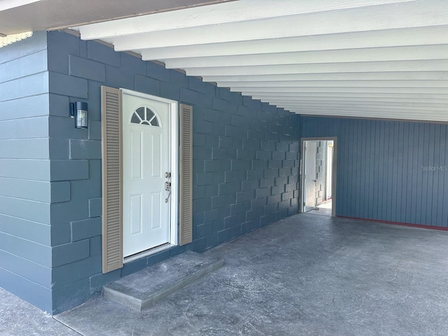1431 Island Dr S, South Pasadena, FL 33707 - property entrance featuring a carport and concrete block siding