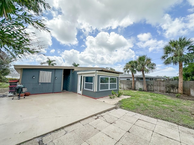 1431 Island Dr S, South Pasadena, FL 33707 - rear view of property with a patio and driveway