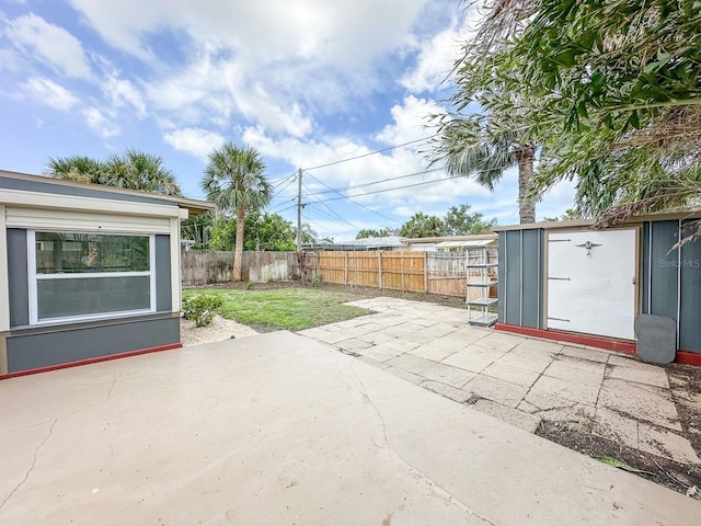 1431 Island Dr S, South Pasadena, FL 33707 - fenced backyard with a patio and a shed