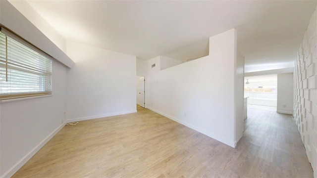 1431 Island Dr S, South Pasadena, FL 33707 - unfurnished room with light wood-style flooring and baseboards