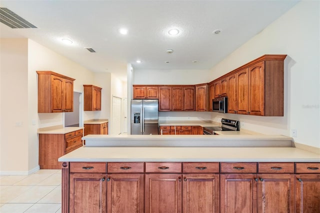117 Camelot Ridge Dr, Brandon, FL 33511 - kitchen with appliances with stainless steel finishes, a peninsula, recessed lighting, light countertops, and light tile patterned flooring