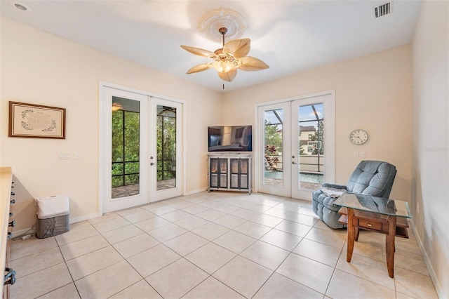 117 Camelot Ridge Dr, Brandon, FL 33511 - sitting room with french doors, light tile patterned flooring, and ceiling fan
