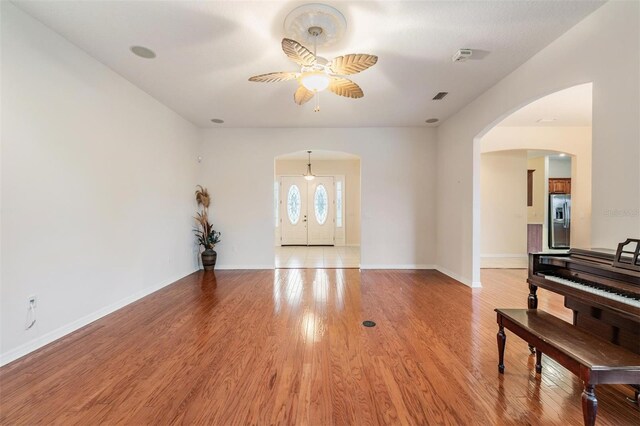 117 Camelot Ridge Dr, Brandon, FL 33511 - entrance foyer featuring a ceiling fan, arched walkways, and light wood-type flooring
