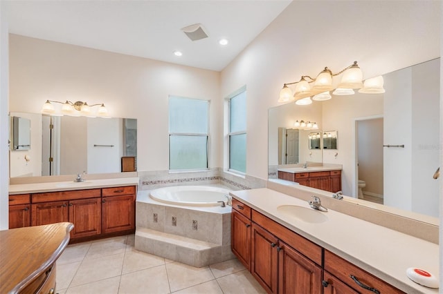117 Camelot Ridge Dr, Brandon, FL 33511 - full bath featuring a garden tub, two vanities, and tile patterned floors