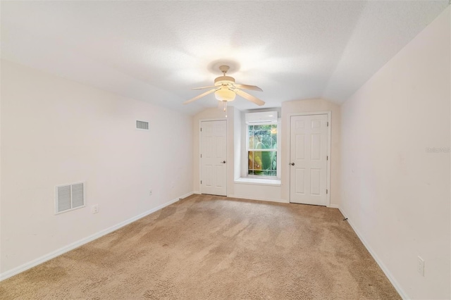 117 Camelot Ridge Dr, Brandon, FL 33511 - spare room with vaulted ceiling, a ceiling fan, and light colored carpet