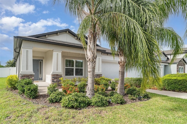 11444 Alachua Creek Ln, Riverview, FL 33579 - view of front of property featuring stone siding, stucco siding, and an attached garage