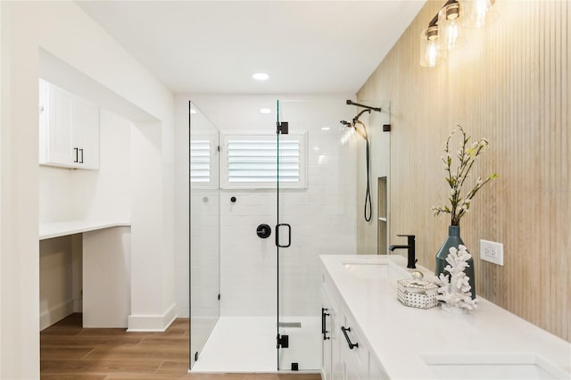 1908 Sutherland Dr W, Palm Harbor, FL 34683 - full bath with a shower stall, double vanity, wood finished floors, and recessed lighting