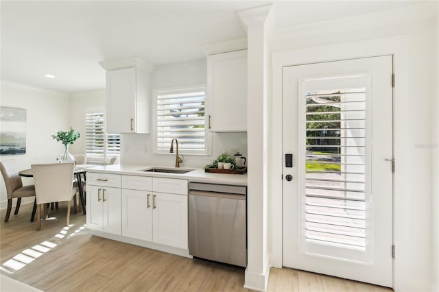 1908 Sutherland Dr W, Palm Harbor, FL 34683 - kitchen with dishwasher, light countertops, white cabinetry, and light wood-style floors