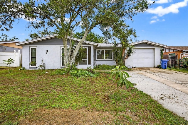 7814 Burnham Dr, Port Richey, FL 34668 - mid-century inspired home featuring an attached garage, driveway, and stucco siding