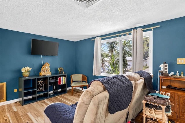 7814 Burnham Dr, Port Richey, FL 34668 - living area featuring wood finished floors and a textured ceiling