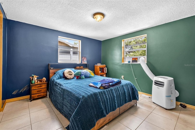 7814 Burnham Dr, Port Richey, FL 34668 - bedroom featuring tile patterned floors and a textured ceiling