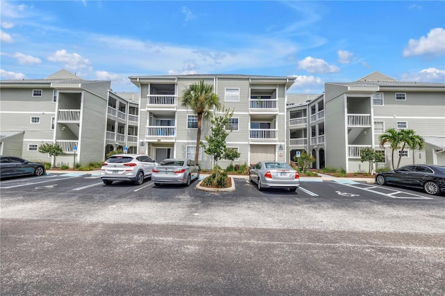 6916 Stones Throw Cir N Unit 9207, Saint Petersburg, FL 33710 - view of apartment building / complex featuring uncovered parking