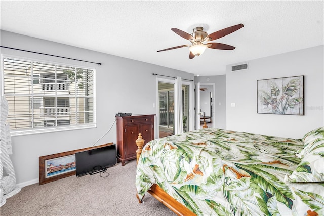 6916 Stones Throw Cir N Unit 9207, Saint Petersburg, FL 33710 - bedroom featuring carpet, access to outside, ceiling fan, and a textured ceiling