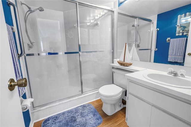 6916 Stones Throw Cir N Unit 9207, Saint Petersburg, FL 33710 - full bath featuring a stall shower, vanity, and wood finished floors