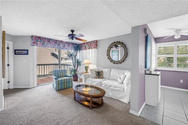 6916 Stones Throw Cir N Unit 9207, Saint Petersburg, FL 33710 - carpeted living area with ceiling fan, a textured ceiling, and tile patterned floors