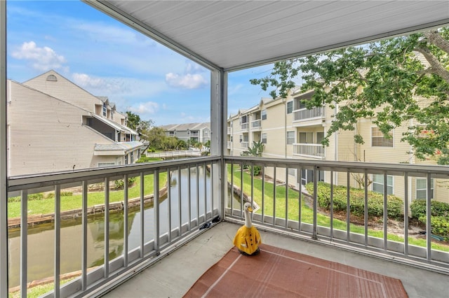 6916 Stones Throw Cir N Unit 9207, Saint Petersburg, FL 33710 - balcony featuring a residential view and a water view