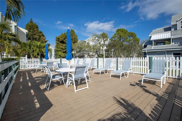6916 Stones Throw Cir N Unit 9207, Saint Petersburg, FL 33710 - wooden deck with outdoor dining area