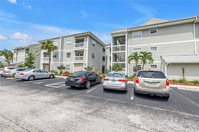 6916 Stones Throw Cir N Unit 9207, Saint Petersburg, FL 33710 - view of building exterior featuring uncovered parking