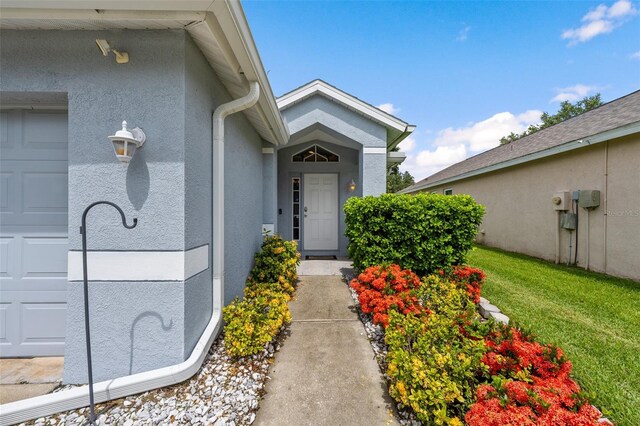 5112 Prairie View Way, Wesley Chapel, FL 33545 - property entrance featuring stucco siding and an attached garage