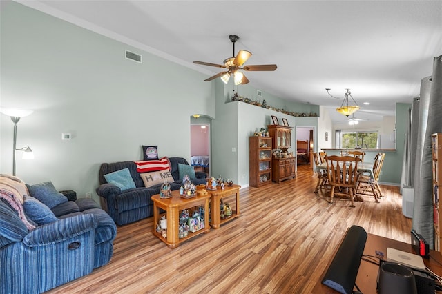 5112 Prairie View Way, Wesley Chapel, FL 33545 - living room featuring light wood finished floors, a ceiling fan, and arched walkways