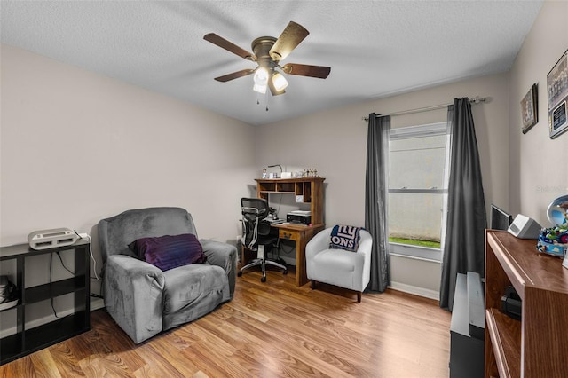 5112 Prairie View Way, Wesley Chapel, FL 33545 - living area with a ceiling fan, wood finished floors, a textured ceiling, and an office area