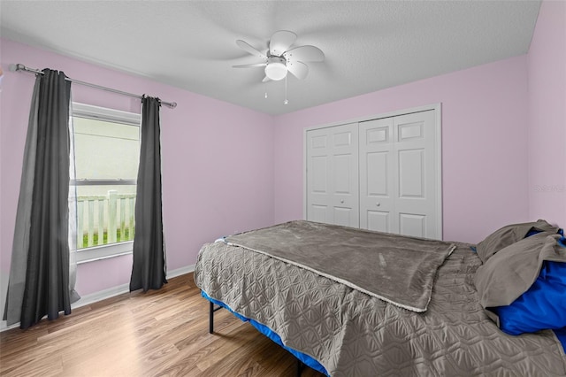 5112 Prairie View Way, Wesley Chapel, FL 33545 - bedroom featuring light wood finished floors, a closet, and a ceiling fan