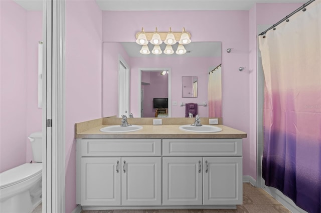 5112 Prairie View Way, Wesley Chapel, FL 33545 - bathroom featuring double vanity, tile patterned flooring, and curtained shower