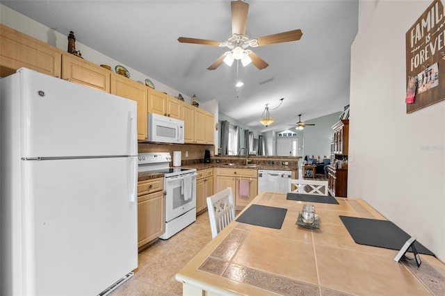 5112 Prairie View Way, Wesley Chapel, FL 33545 - kitchen with white appliances, ceiling fan, a peninsula, light brown cabinetry, and vaulted ceiling