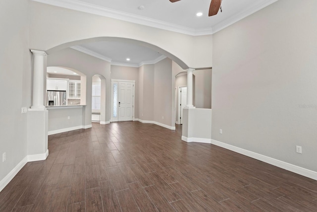 27455 Mistflower Dr, Wesley Chapel, FL 33544 - unfurnished living room featuring ceiling fan, dark wood-type flooring, recessed lighting, arched walkways, and crown molding