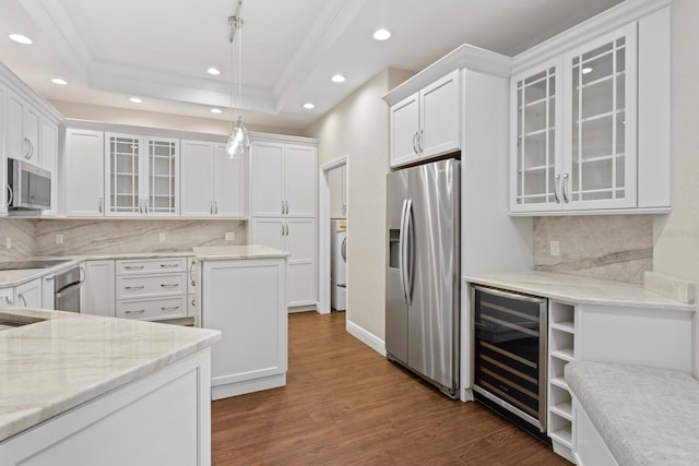 27455 Mistflower Dr, Wesley Chapel, FL 33544 - kitchen featuring stainless steel appliances, wine cooler, recessed lighting, dark wood-style floors, and white cabinetry